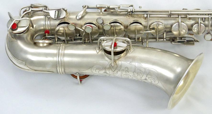 Used Conn New Wonder C-melody tenor saxophone - close up of lower left side