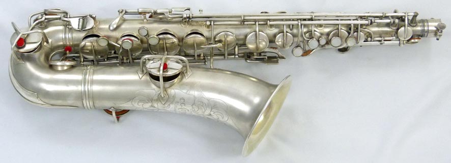 Used Conn New Wonder C-melody tenor sax - close up of lower left side
