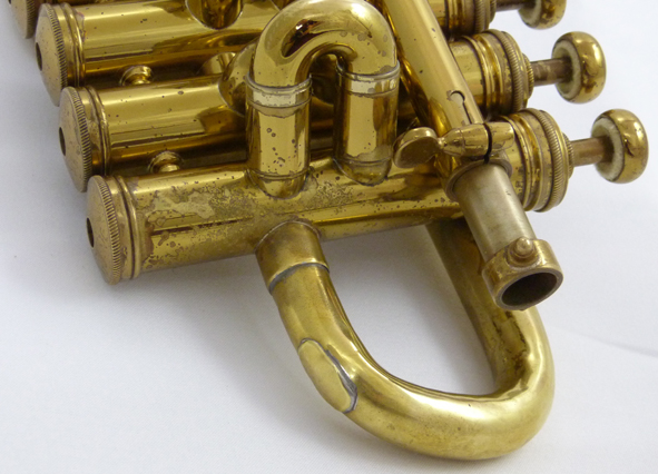Used Selmer Paris piccolo trumpet - close up of patch on bell crook